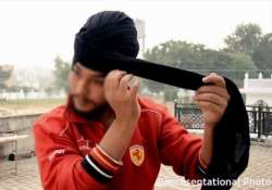 know what forced this sikh guy to remove his turban in middle of the road