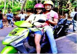 genelia drives around riteish on a scooty in goa