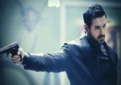 john abraham wields gun in rocky handsome first look