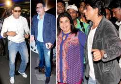 shah rukh abhishek farah boman spotted at airport view pics