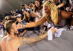 beckham hugged by female fan