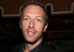 chris martin finds touring expensive