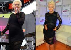 christina aguilera flaunts baby bump