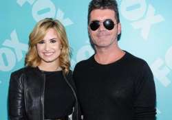 demi lovato finds simon cowell humble