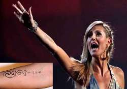 heidi klum to remove seal tattoo