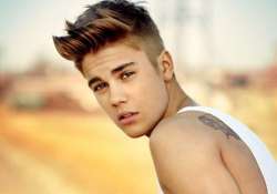 bieber shares image with woman in compromising position