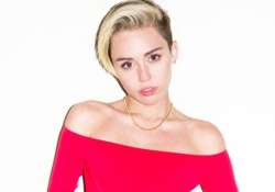 miley cyrus goes topless for campaign again