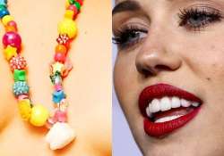 miley cyrus s wisdom tooth necklace