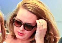 adele flashes ring post split rumours