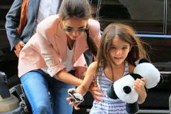 katie holmes enrolls suri in catholic school