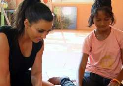 kim kardashian kanye west to adopt thai orphan