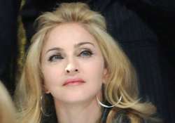 madonna shows derriere to raise fund