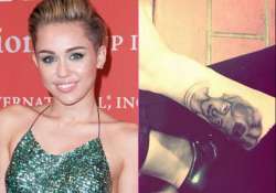 miley cyrus gets grandma s tattoo