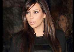 paparazzi threatens kim her unborn child