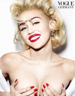 miley cyrus goes topless poses with two men in bed see pics