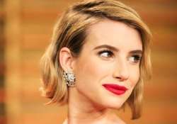 emma roberts matches make up wardrobe with hair colour