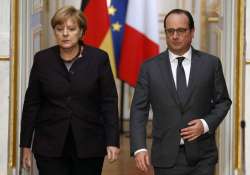 angela merkel francois hollande vow determination to fight terrorism