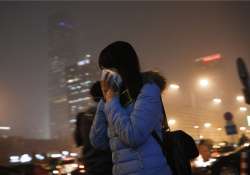 beijing chokes under hazardous air pollution red alert on