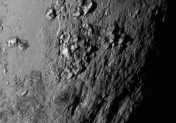 pluto has 11 000 feet high young ice mountains nasa