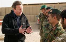 cameron goes to afghanistan promises british pullout next year