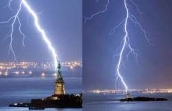 amazing pic of huge lightning bolt striking statue of liberty