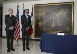 obama pays respects at french embassy after paris attack