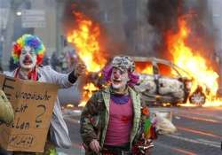 police cars burn at anti austerity protest in germany