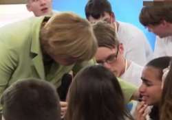 video angela merkel makes a little girl cry faces backlash online