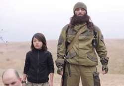 isis video shows child executing two russian agents