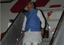 pm modi arrives in canberra summit talks with tony abbott tomorrow