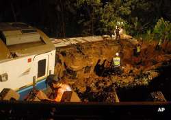 indonesia train derails in landslide three dead