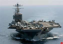 iranian boats shadow us aircraft carrier in gulf