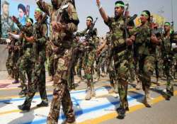 iraq militia parades as insurgents seize crossing