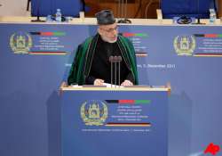 karzai will try to hold on to power beyond 2014 report