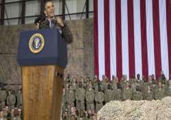 obama pays surprise visit to us troops pledges responsible end to afghanistan war