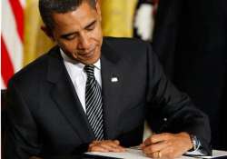 obama signs defense bill despite reservations