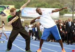 prince harry runs with usain bolt in jamaica