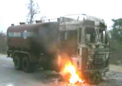 14 trucks torched after woman s death under wheels