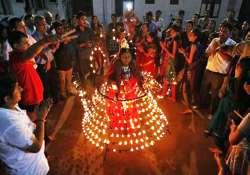 ahmedabad dancer wears metal costume decorated with 1 261 oil lamps during navratri