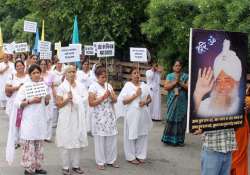 asaram supporters take out silent march