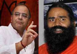 bjp wary as ramdev insists on banking transaction tax demonetization of high value currency notes