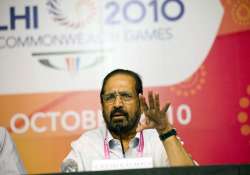 cong cracks whip on kalmadi suspends him after cbi arrest