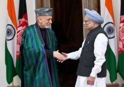 hamid karzai meets pm urges indian companies to invest in afghanistan