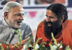 ramdev praises modi for promoting yoga on world stage