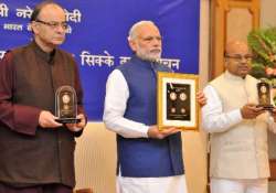 pm modi releases commemorative coins on b.r. ambedkar