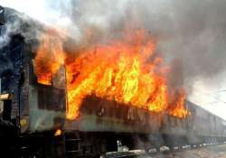 mob sets afire train compartment at delang station