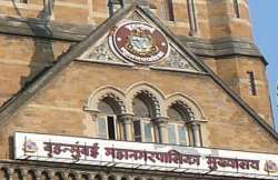 bmc uses adarsh row to regain occupancy certificate powers