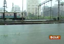 mumbai braces for more rain rail services resume