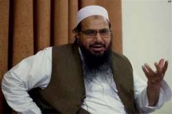 india slams pakistan for clean chit to hafiz saeed