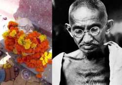 shocking head of mahatma gandhi s statue falls off during garland ceremony in gujarat